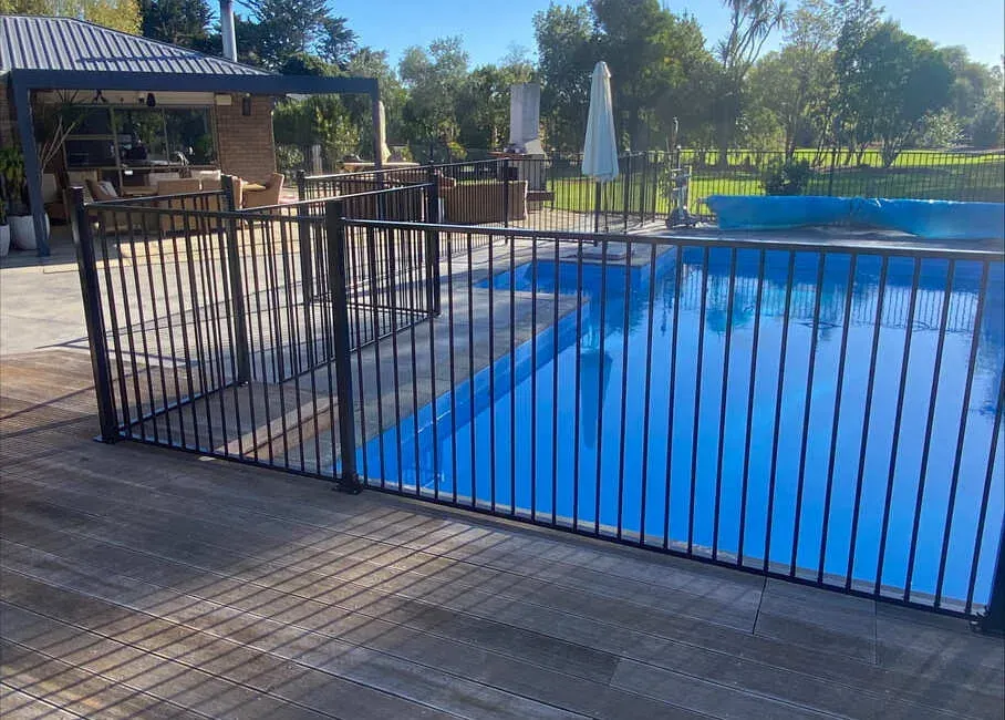 Black aluminium pool fence beside a timber deck, Palmerston North