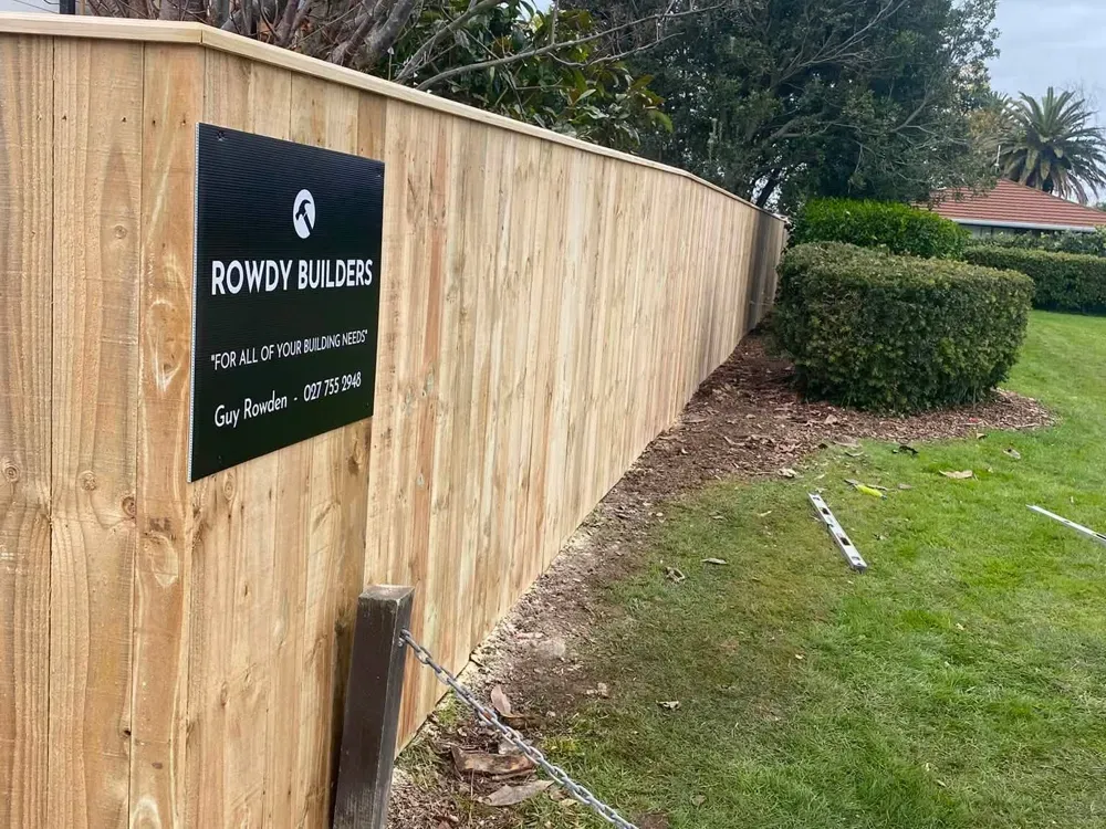 Capped timber paling fence on a corner section in Palmerston North