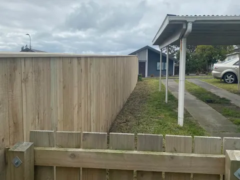 Timber paling fence with a gate beside a driveway, Palmerston North