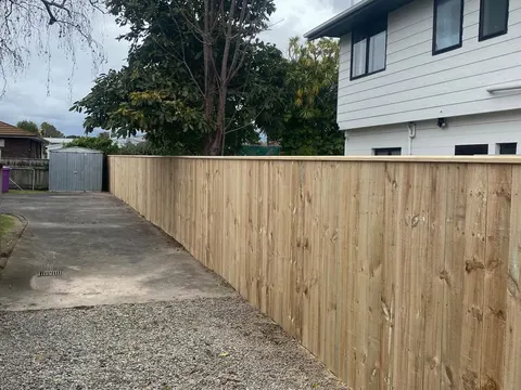 Long timber fence along a gravel driveway, Palmerston North