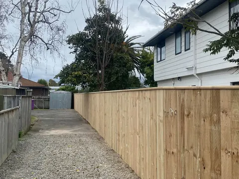New timber fence beside a gravel access way, Palmerston North