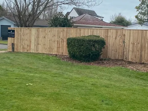 Timber paling fence behind a lawn, Palmerston North