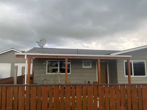 Stained timber fence across the front of a home, Palmerston North