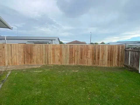 Timber paling fence across a lawn, Palmerston North